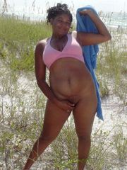 Old ebony mom posing nude on fresh air